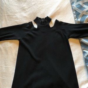 Exposed shoulder black sweater